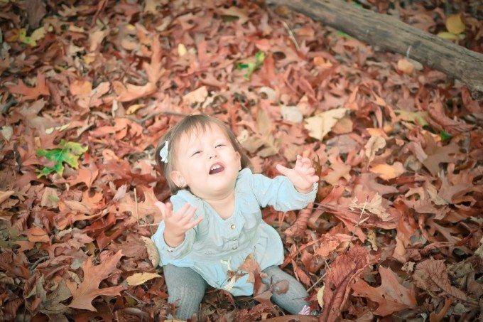 baby in leaves